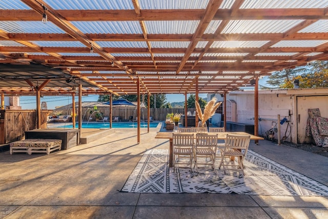 view of patio / terrace featuring a pergola and a fenced in pool