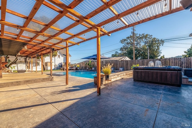 view of patio featuring a swimming pool with hot tub and pool water feature