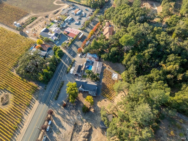 birds eye view of property with a rural view