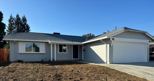 ranch-style house featuring a garage