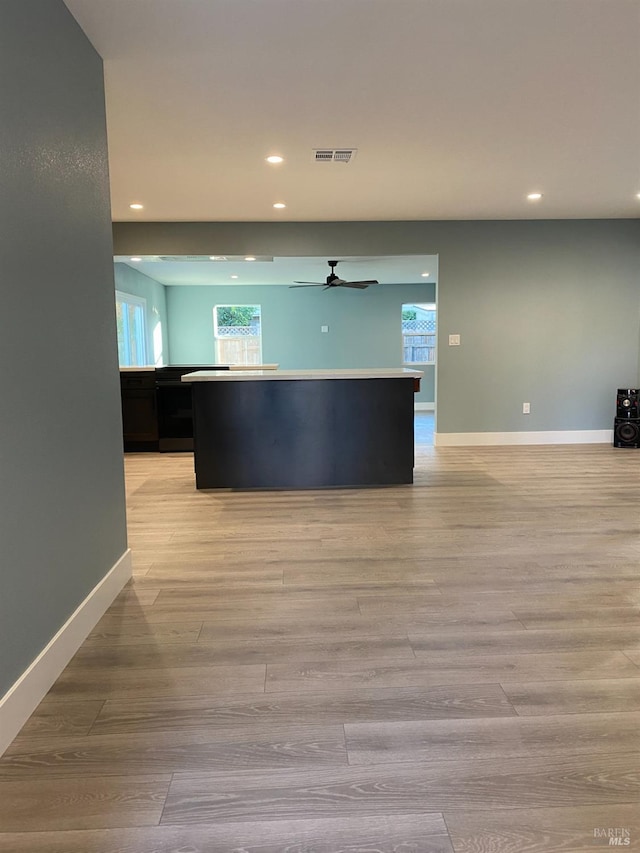 kitchen with ceiling fan, light wood-type flooring, recessed lighting, and visible vents