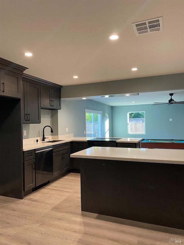 kitchen featuring stainless steel dishwasher, visible vents, recessed lighting, light countertops, and a sink