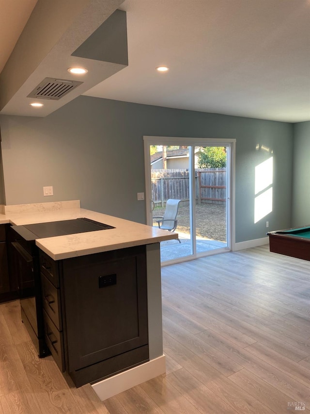 kitchen with visible vents, baseboards, black appliances, light wood-style floors, and recessed lighting