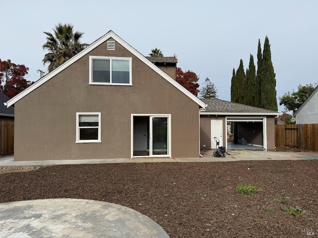 back of house with a patio