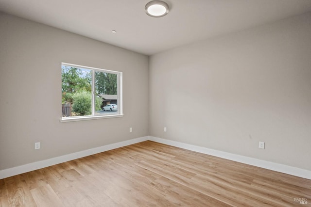 spare room featuring light hardwood / wood-style flooring