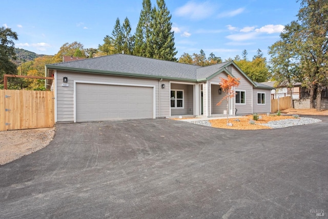 ranch-style home featuring a mountain view and a garage