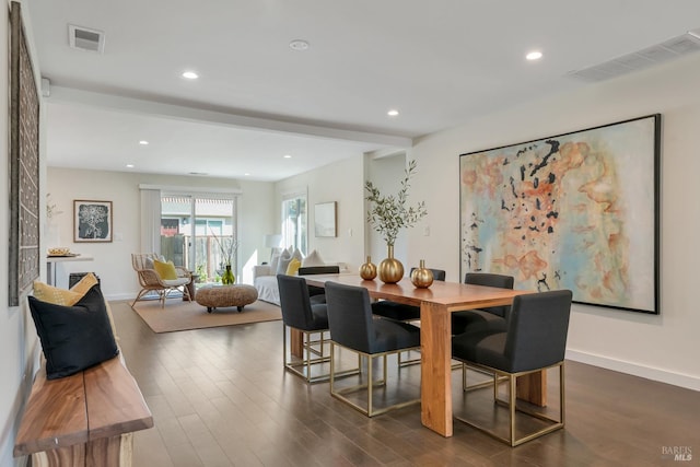 dining space with dark wood-type flooring