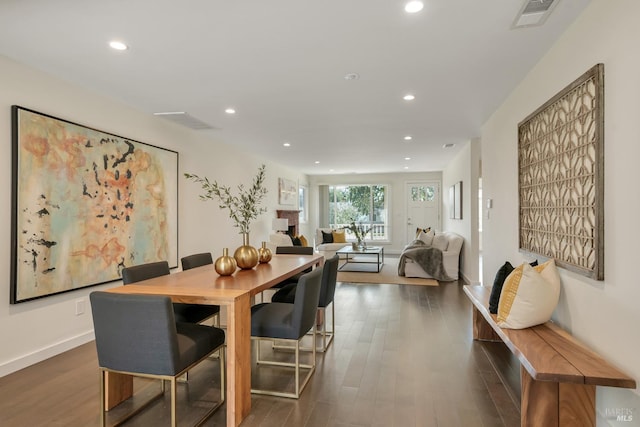 dining space featuring dark hardwood / wood-style floors