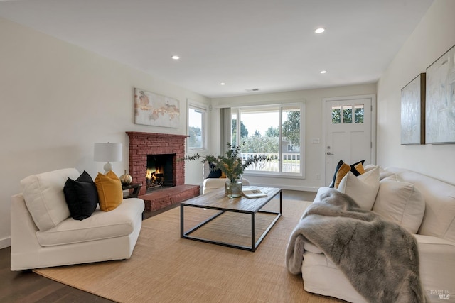 living room with a fireplace and light hardwood / wood-style floors