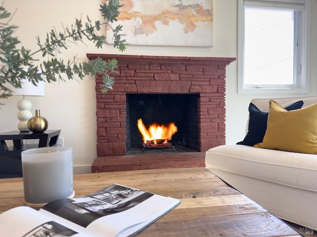 living room featuring a fireplace and hardwood / wood-style floors