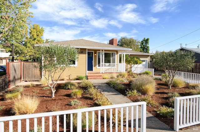 view of front facade with a garage and a porch