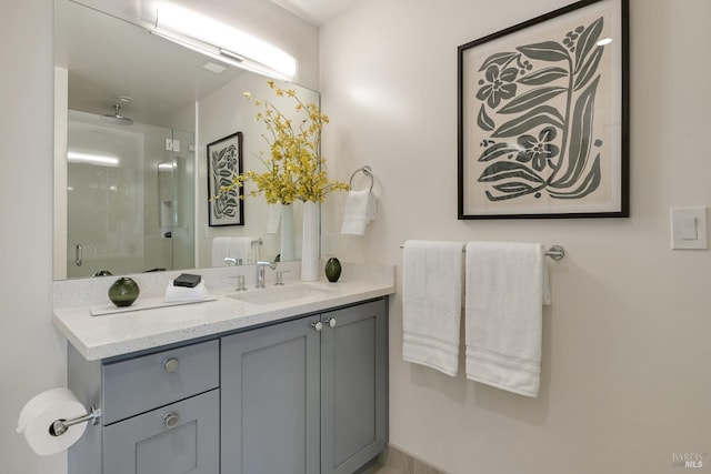 bathroom featuring an enclosed shower and vanity