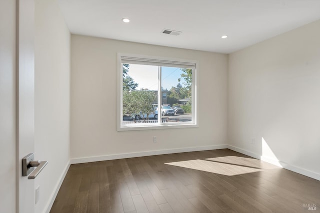 empty room with dark hardwood / wood-style floors