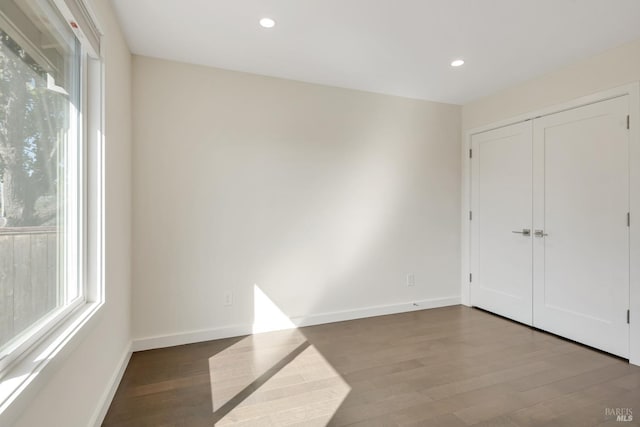 unfurnished bedroom featuring hardwood / wood-style floors