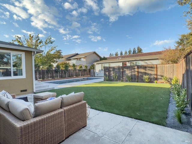 view of yard featuring a fenced in pool, a patio area, and outdoor lounge area