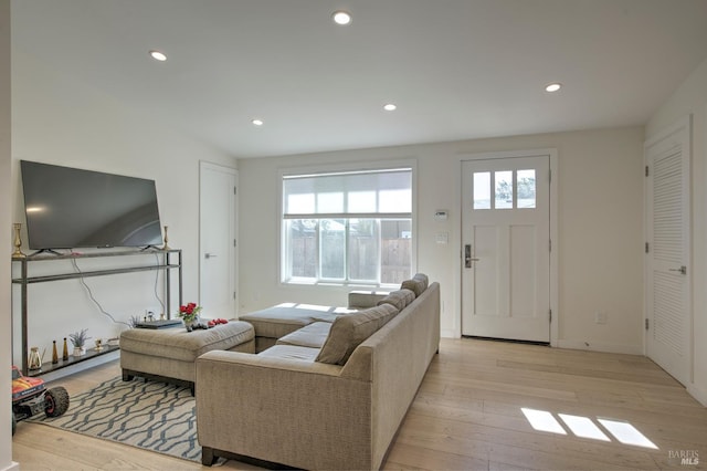 living room with light hardwood / wood-style floors