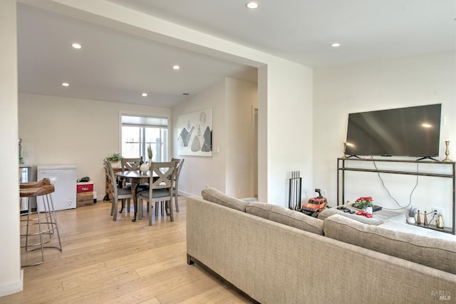 living room with light hardwood / wood-style flooring