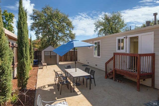 view of patio / terrace with a shed