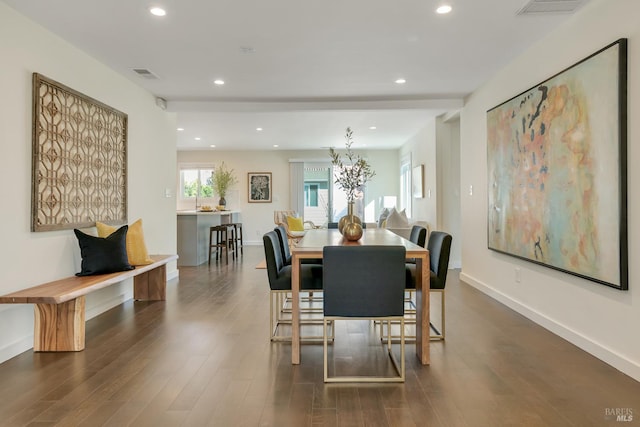 dining space featuring dark hardwood / wood-style floors