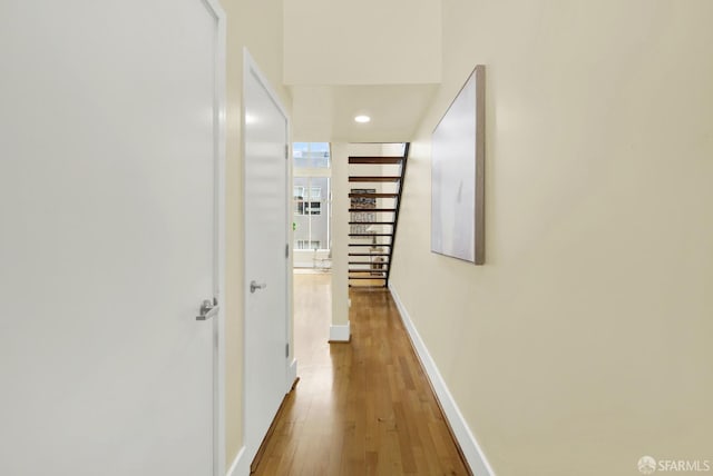 corridor featuring wood-type flooring