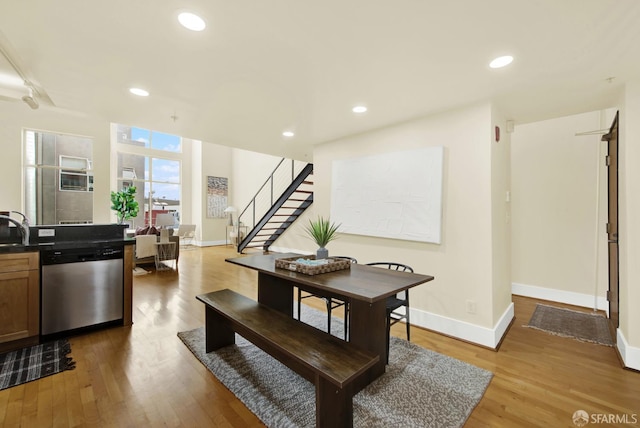 dining area featuring light wood-type flooring