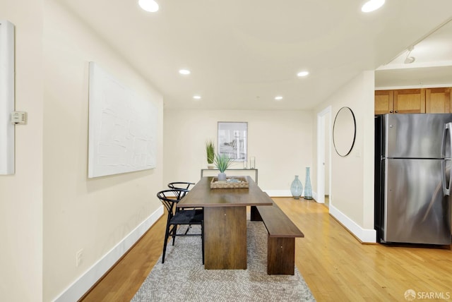 dining space featuring light hardwood / wood-style flooring