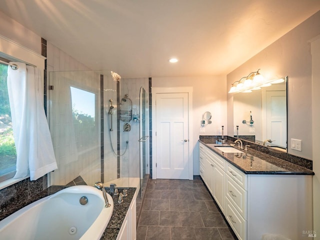 bathroom with vanity, plenty of natural light, and plus walk in shower