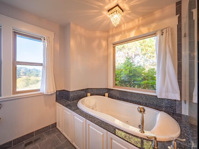 bathroom featuring a bathtub and tile patterned floors