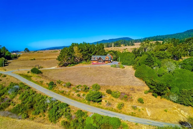 bird's eye view featuring a rural view and a mountain view