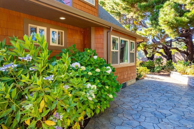 view of side of property with a patio