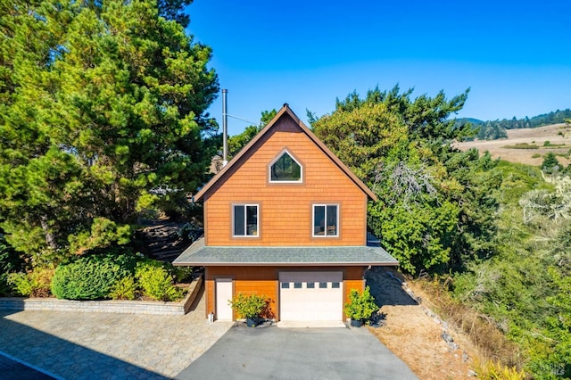 view of side of property featuring a garage