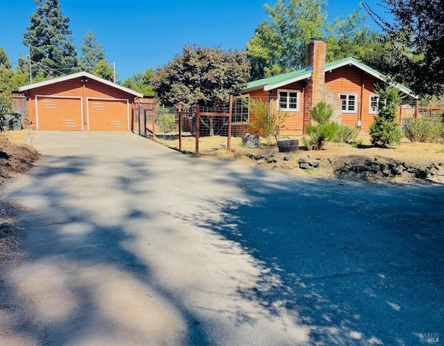 view of home's exterior with an outbuilding and a garage