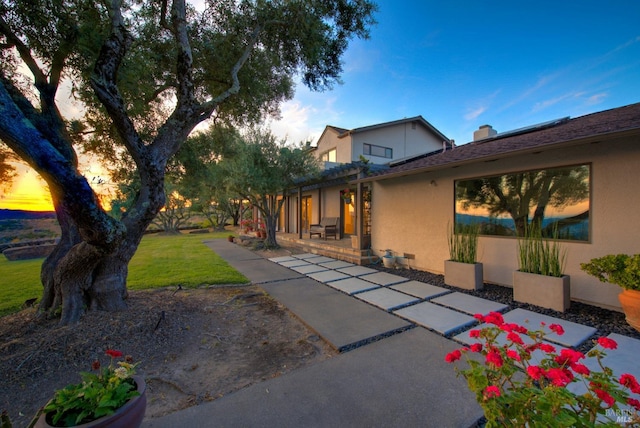 exterior space with a lawn and a patio area