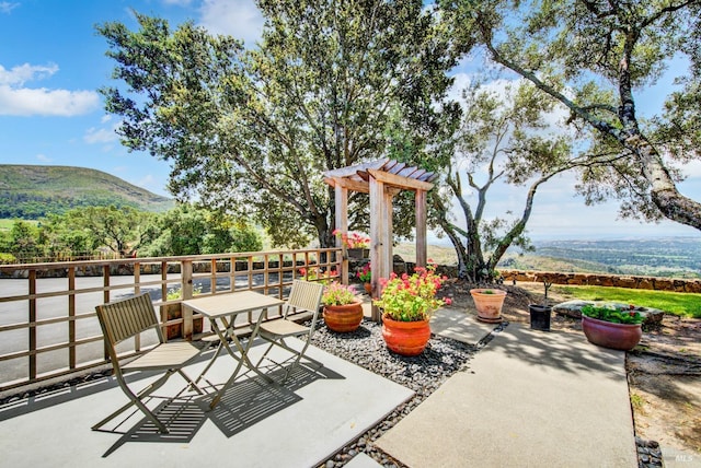 view of patio featuring a mountain view