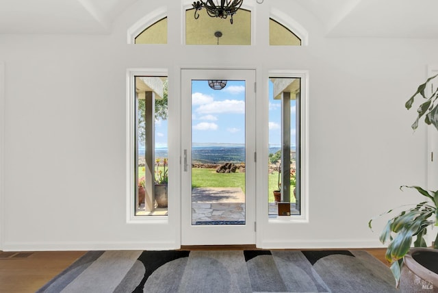 doorway with hardwood / wood-style flooring