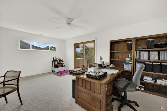 home office featuring ceiling fan and carpet flooring