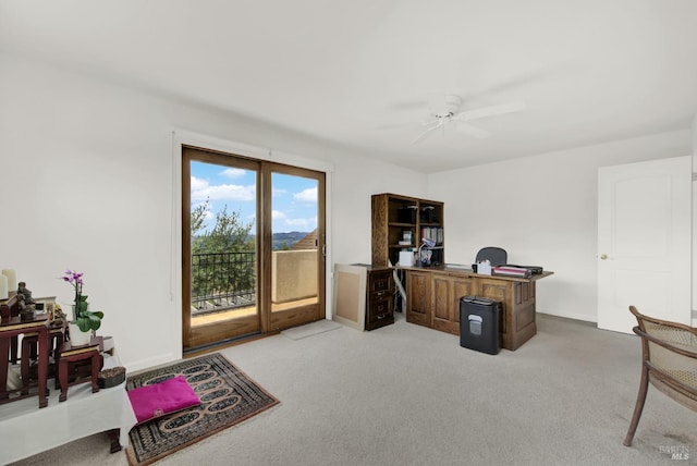 office featuring light carpet and ceiling fan