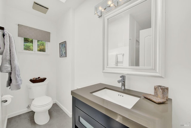 bathroom with toilet and vanity