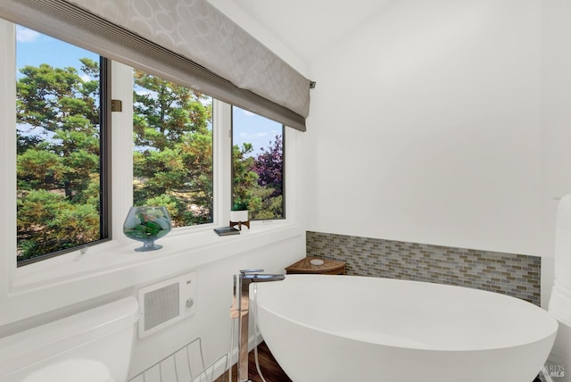 bathroom featuring a washtub