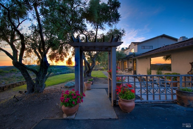 view of gate at dusk