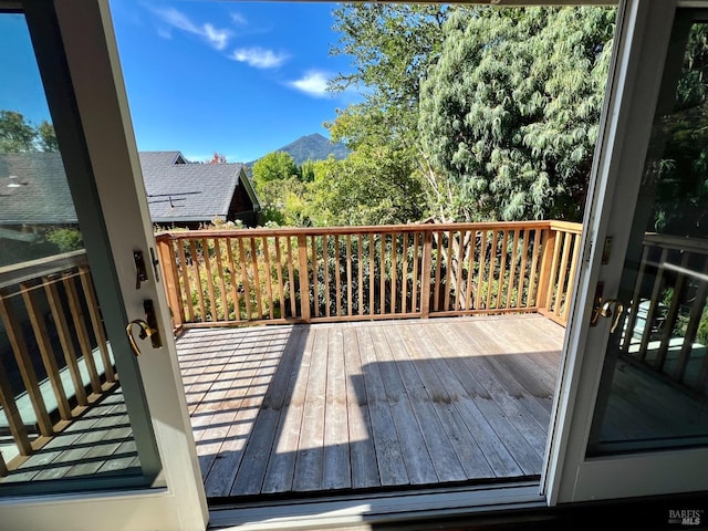 wooden deck featuring a mountain view