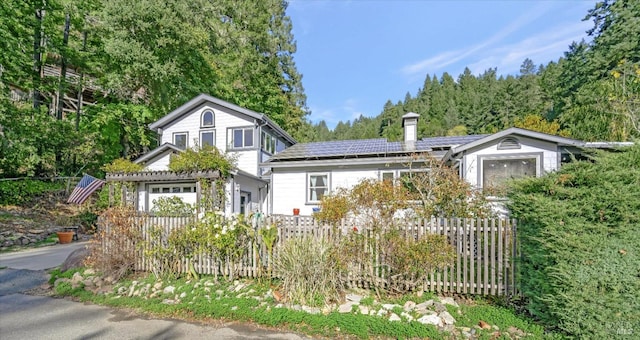 view of front of home with solar panels