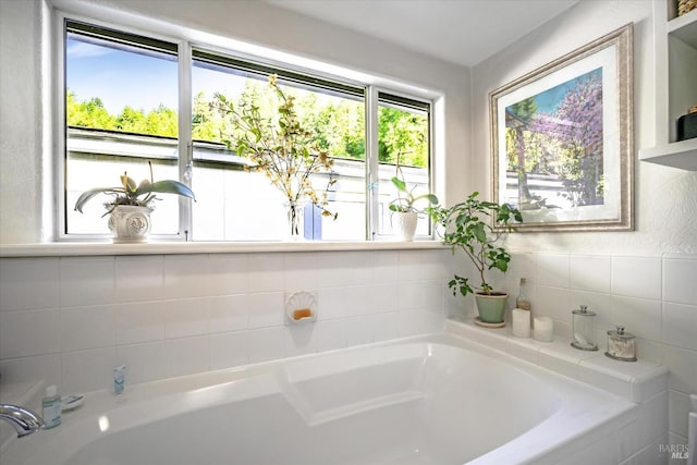 bathroom with tiled tub