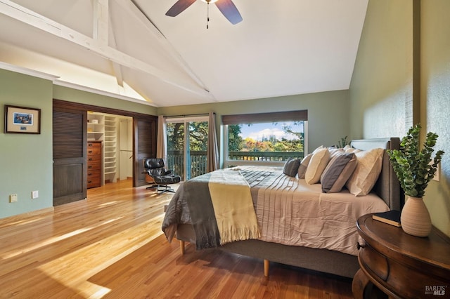 bedroom featuring beamed ceiling, wood-type flooring, access to exterior, and ceiling fan