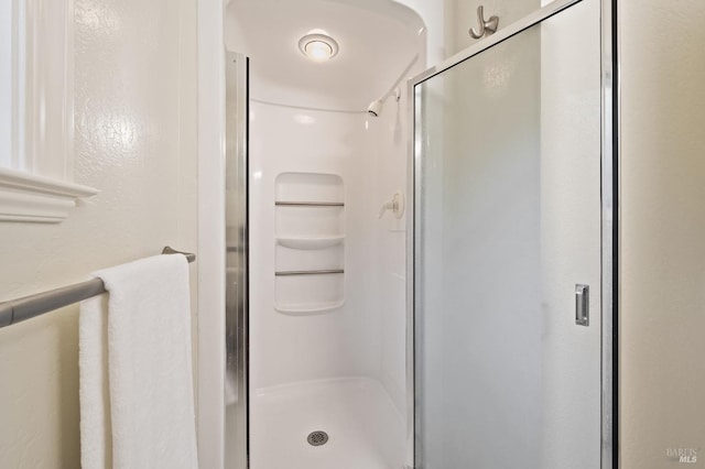 bathroom featuring walk in shower