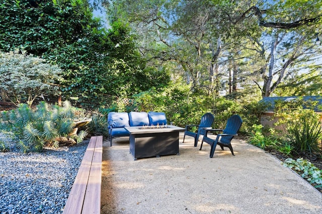 view of patio / terrace with an outdoor living space with a fire pit