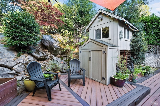 wooden terrace featuring a storage unit