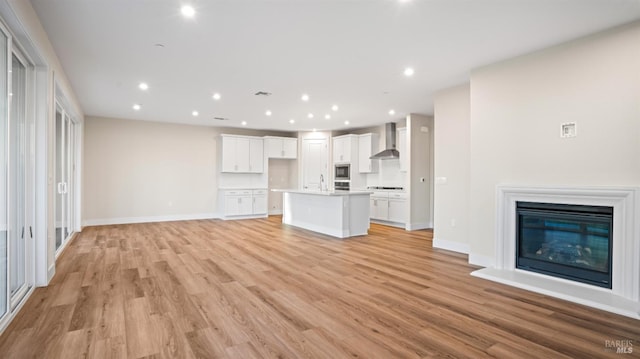 unfurnished living room featuring light hardwood / wood-style floors