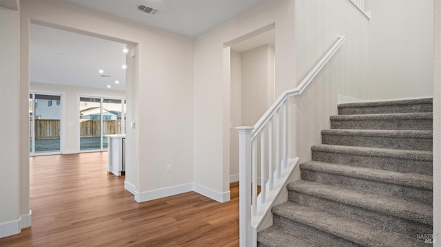 stairway with wood-type flooring