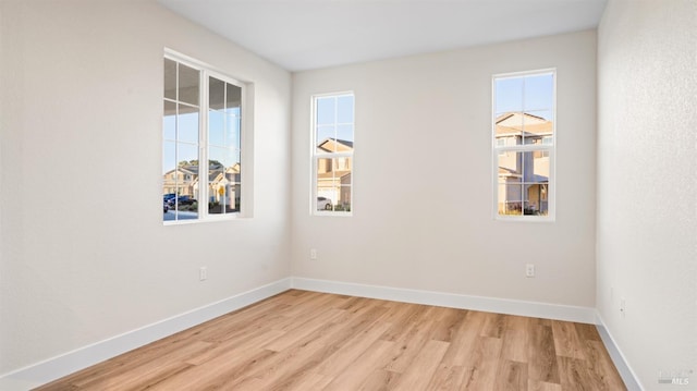 spare room with light wood-type flooring